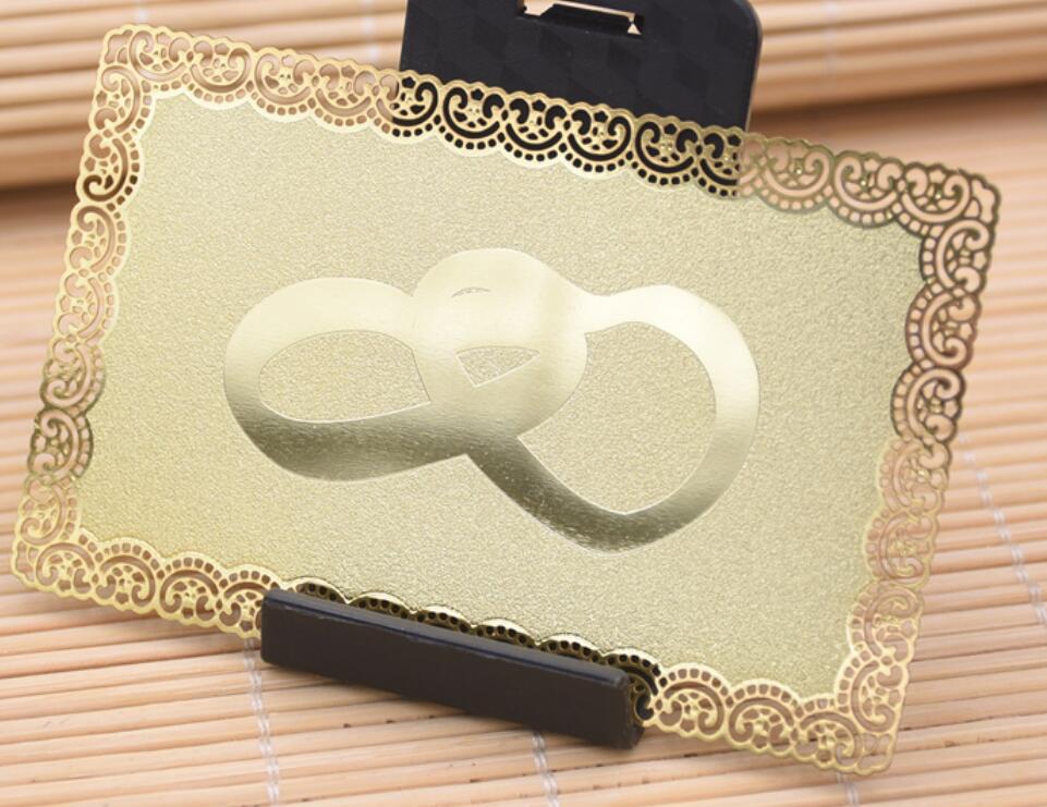 gold metal card with frosted background, glossy gold logo, cutout lace