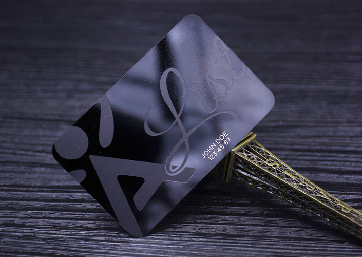 Glossy black metal card, linen logo, laser engraved