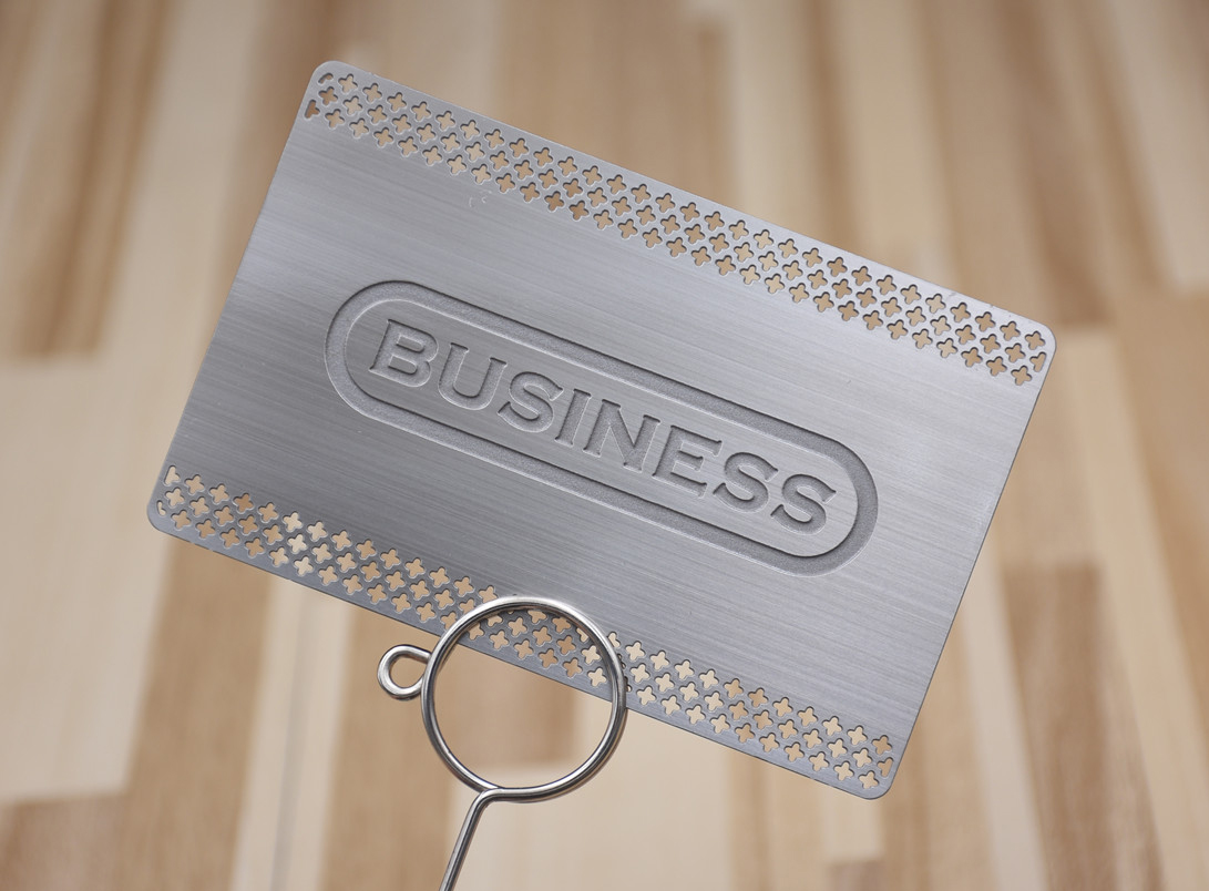 Silver brushed metal card, cutout lace, deep etched logo