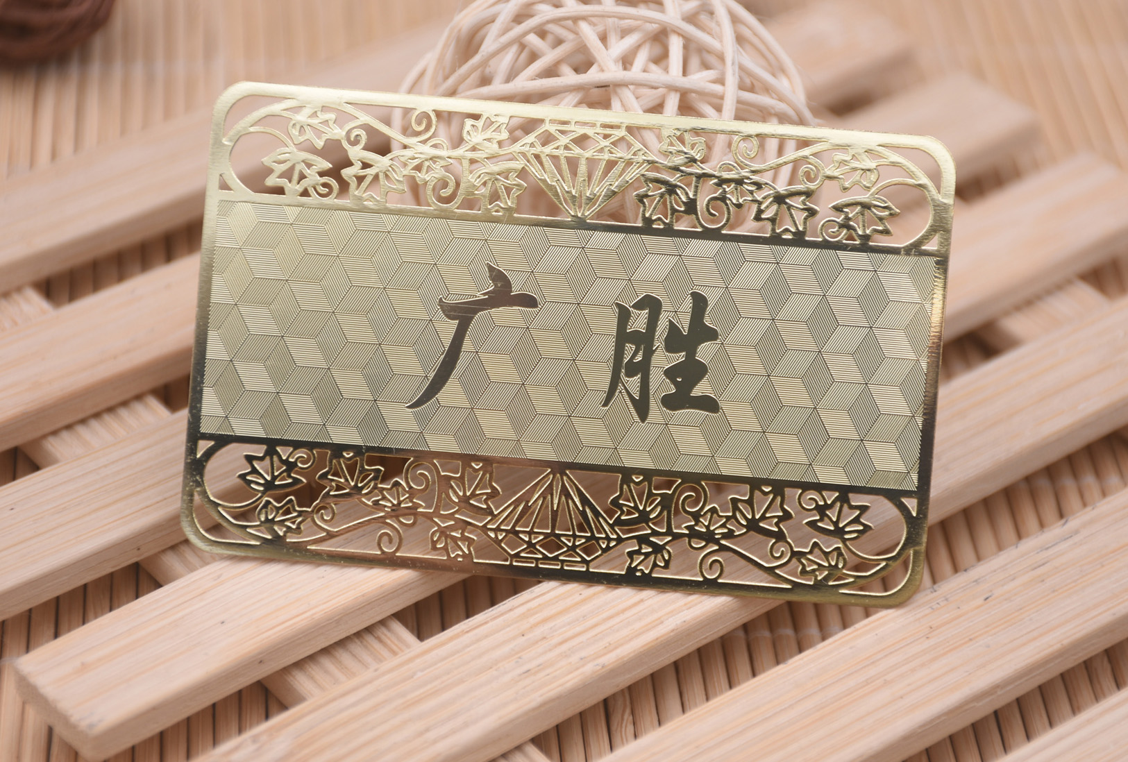 Shiny gold metal card, cutout lace, Carbon Fiber background