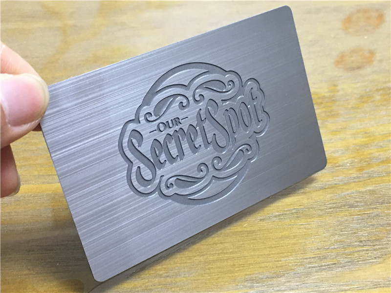 Silver brushed metal card, deep etched logo