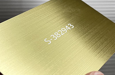 laser engraved number on gold brushed